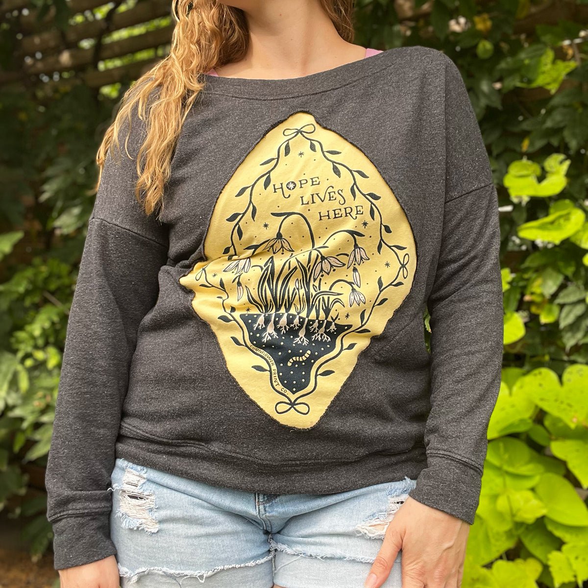 Hope Lives Here | Snow Drops | January Birth Flower | Dark Gray Sweater with Pockets | Medium