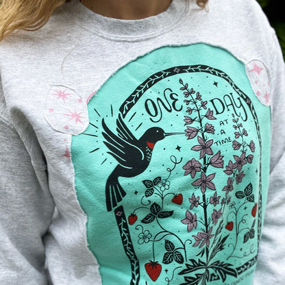One Day at a Time | July Birth Flower | Gray / Blue Reverse Applique Pullover Sweatshirt | Medium