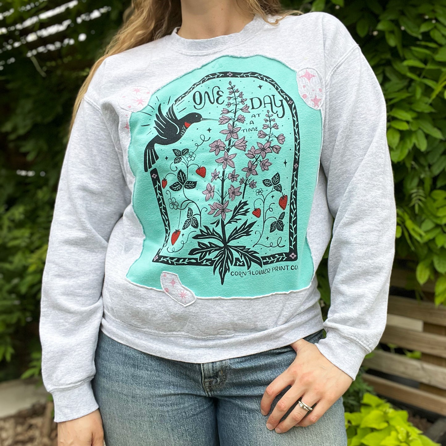 One Day at a Time | July Birth Flower | Gray / Blue Reverse Applique Pullover Sweatshirt | Medium