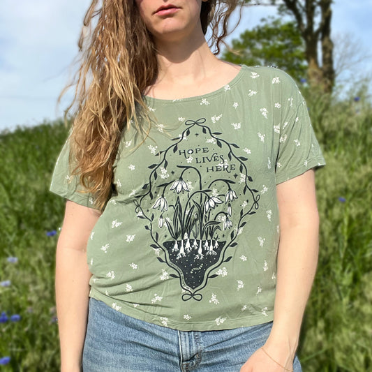 Hope Lives Here | Snow Drops | January Birth Flower | Green Floral Tee | Medium