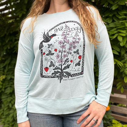 One Day at a Time | July Birth Flower | Light Blue Sweater | Medium