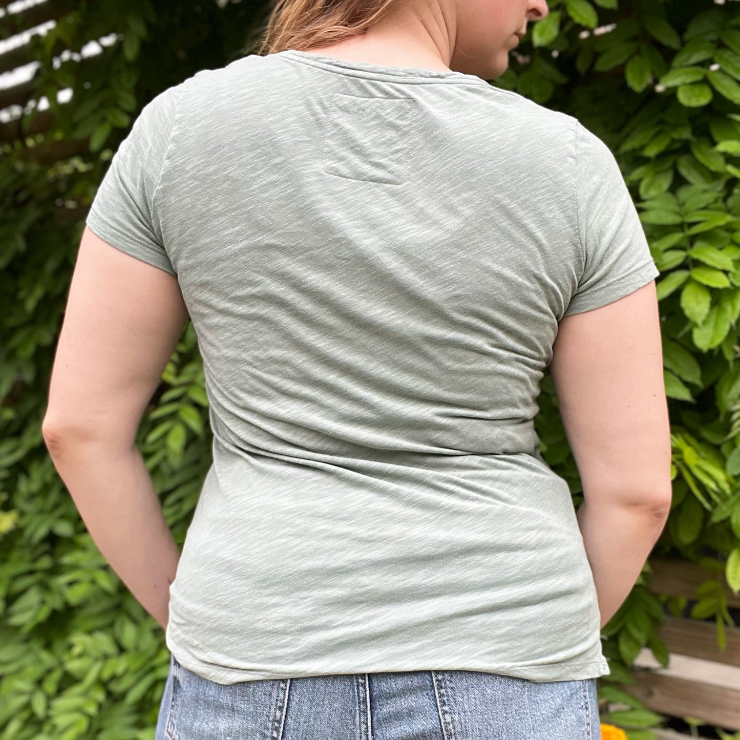One Day at a Time | July Birth Flower | Muted Green V-Neck Tee | Small