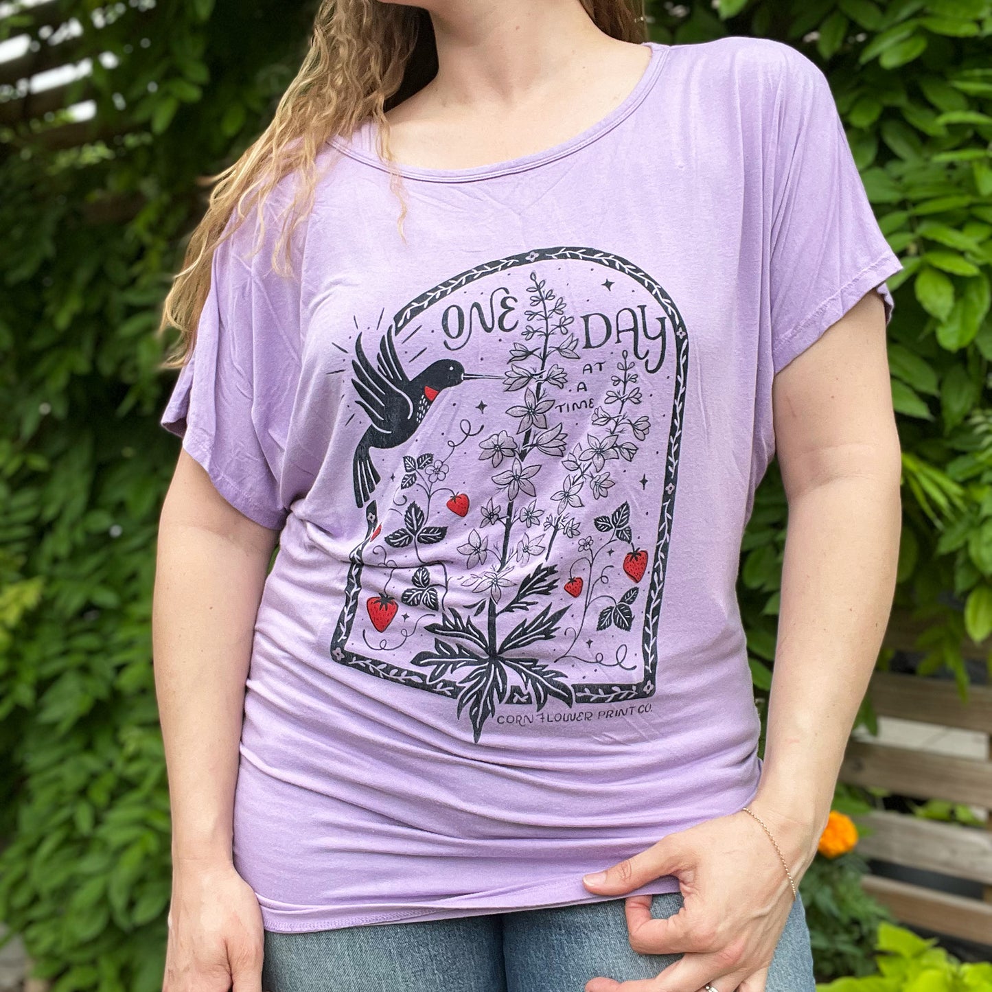One Day at a Time | July Birth Flower | Purple Raglan Short Sleeve w Ruched Sides | XL