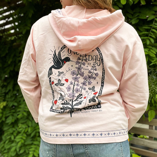 One Day at a Time | July Birth Flower | Pink Zip Up Hoodie Jacket w Embroidery Detail | Large